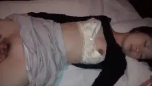 Pretty girl gets fingered while sleeping.