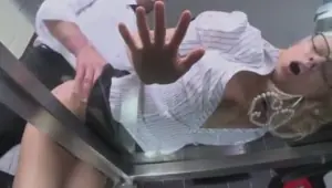 Blonde office girl helps a businessman relax