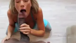 Hungry blonde swallows a big black cock