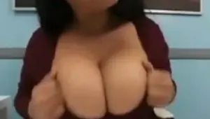 Ebony office girl with huge tits shows off and teases