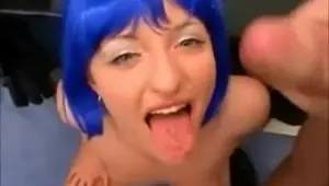 German slut with blue wig enjoys sucking cocks.