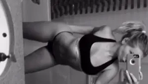 Hot blonde babe shows off her hot body with her phone