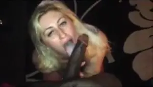 Raunchy floozie sucking a massive black prick