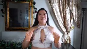 DOminatrix Mara Draws Flowers on Her Leather Gloves