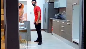 masked amateur couple having fun at home