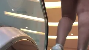 Hot naughty hotwife shows off in the mall parking lot for cuckold, walking in catwalk style mini ski