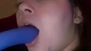 Pretty face sucks pretty dildo