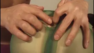 FORBIDDEN EAST Oriental girl in ripped pantyhose bends over and sucks cock for two guys