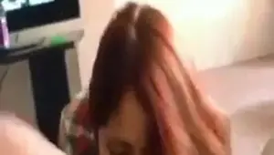 Sexy redheaded girl taking care of her guy