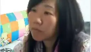 Mature Chinese Woman Shows Off Breasts