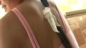 Cute Japanese Teen in pink leotard with lollipop