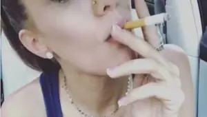 Gorgeous young brunette girl smoking sexy