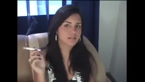 Darked haired cutie smoking