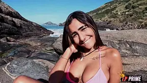 Naughty brunette shows off on the beach and gives her tight ass Tiffany Loupan productions