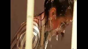 Blonde babe gets a bukkake facial while in prison